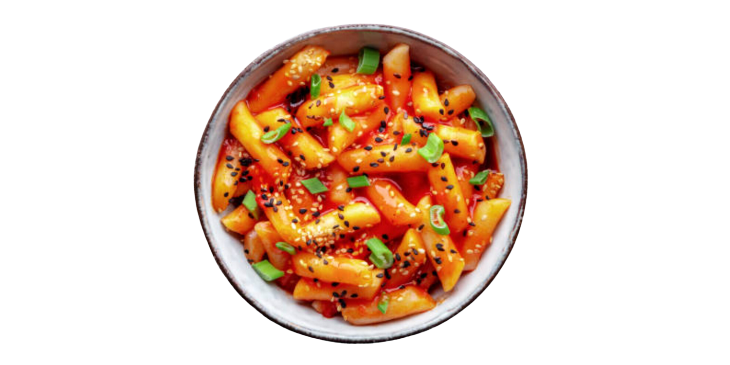 korean rice cake with spicy red sauce and green onion and sesame