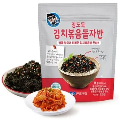 A package of Korean seaweed rice snack with two small bowls showing the prepared food: dark seaweed on rice and a side of red kimchi, set against a plain white background.