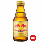 A bottle of Kratingdaeng Super Energy Drink with a gold cap and a gold label featuring the red bull logo, shown against a plain white background.
