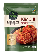 A 500g package of bibigo Kimchi Sliced Kimchi, featuring a dark green and cream-colored stand-up pouch with a photo of the sliced red kimchi on the front.