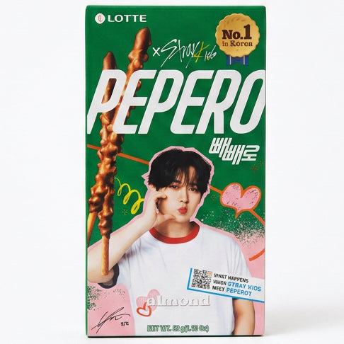 A box of Lotte x Stray Kids Pepero Almond chocolate sticks, featuring a green background with a photo of Billlie, pink heart graphics, and a gold 'No.1 in Korea' seal.