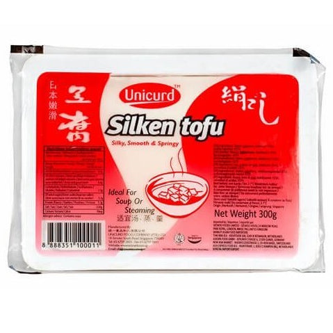 A package of Unicyrd Silken tofu, featuring a white and red label with Chinese characters and a bowl of tofu soup graphic, set against a plain white background.